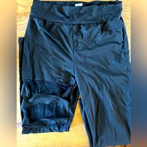 TWO PACK Black size large leggings. One mesh thigh cut outs second mesh sides.